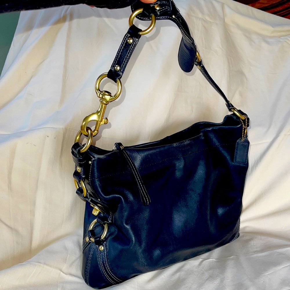 Large Coach shoulder bag with gold hardware. GREAT condition. Badass chic.
